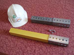Safe-T-Post (yellow) in existing infrastructure "boot". Steel Telspar behind